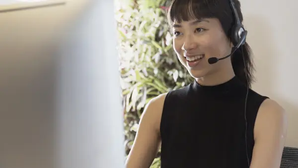 strategy call smiling support person with headset