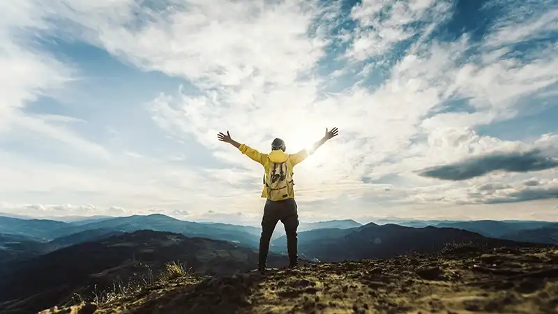 content strategy summit man on mountain enjoying nature