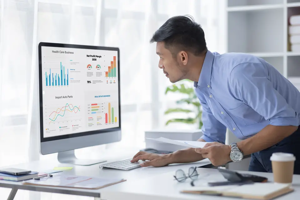 analytics man accessing and analyzing reporting metrics